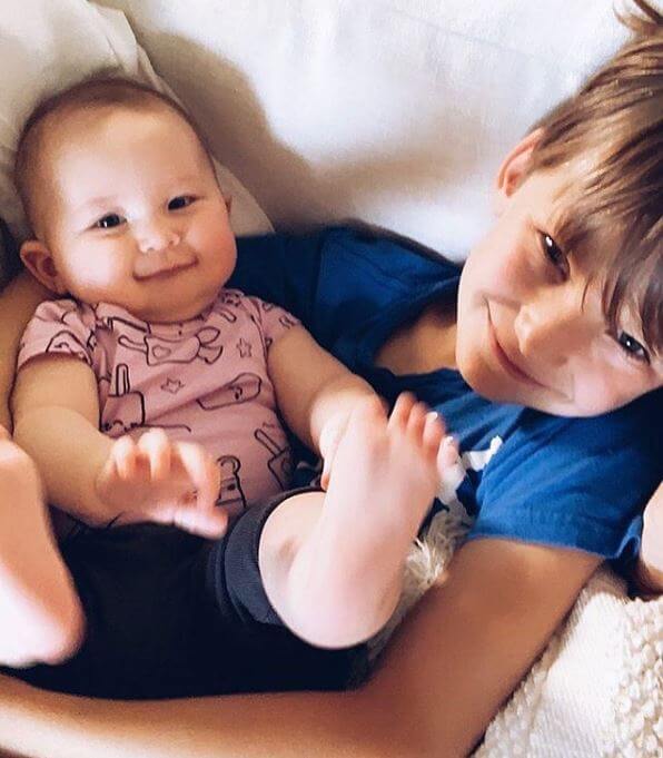 holding his little sister